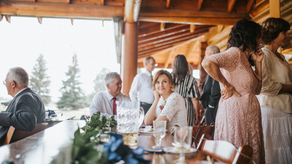 guests sitting at a bar during a summer wedding in Tennessee