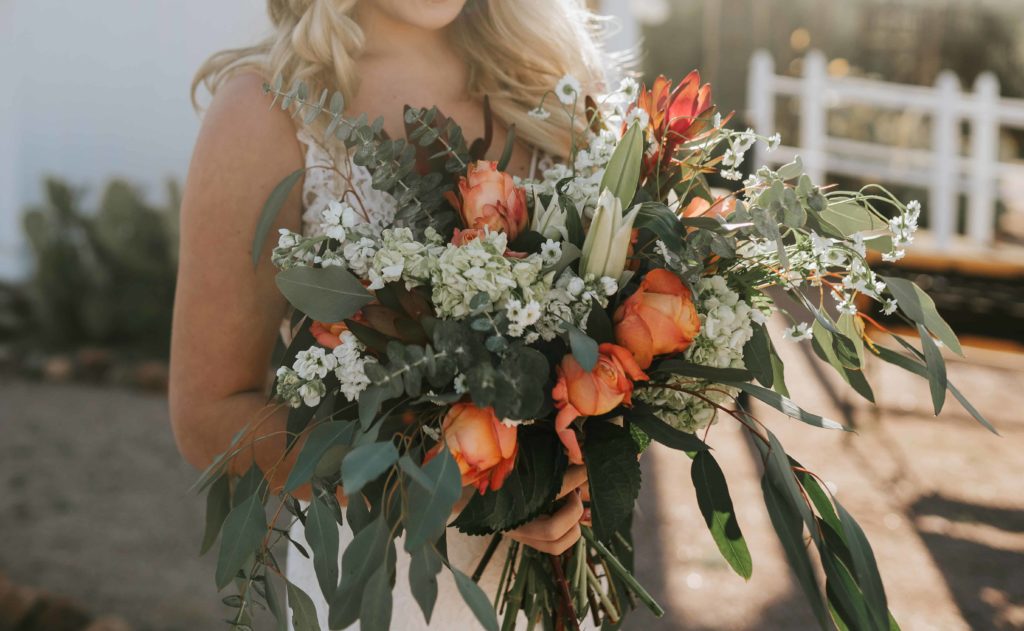 boho bride holding a desert bouquet for her summer wedding in Tennessee