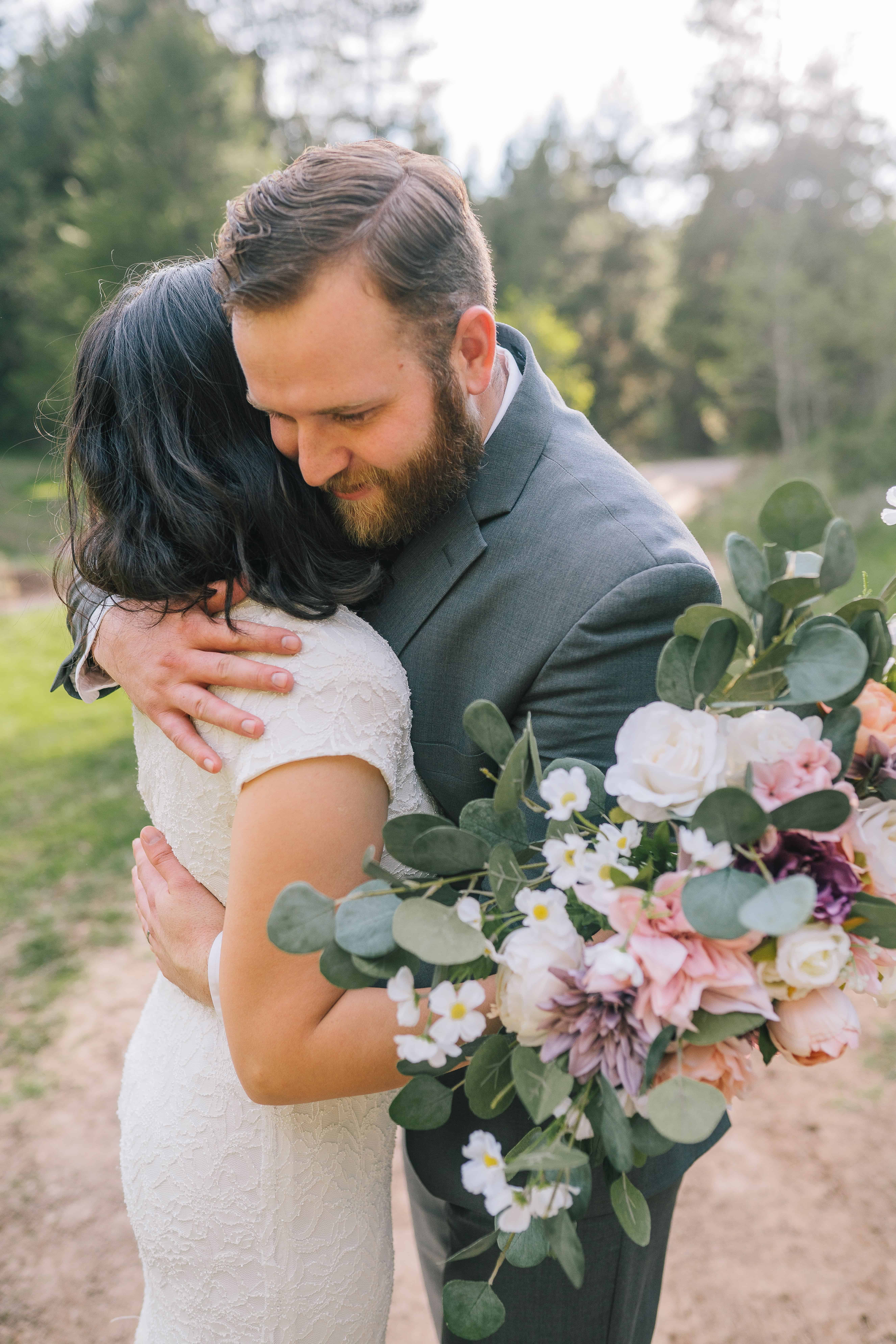 groom huggin his bride during their first look in the Smokies on their wedding day