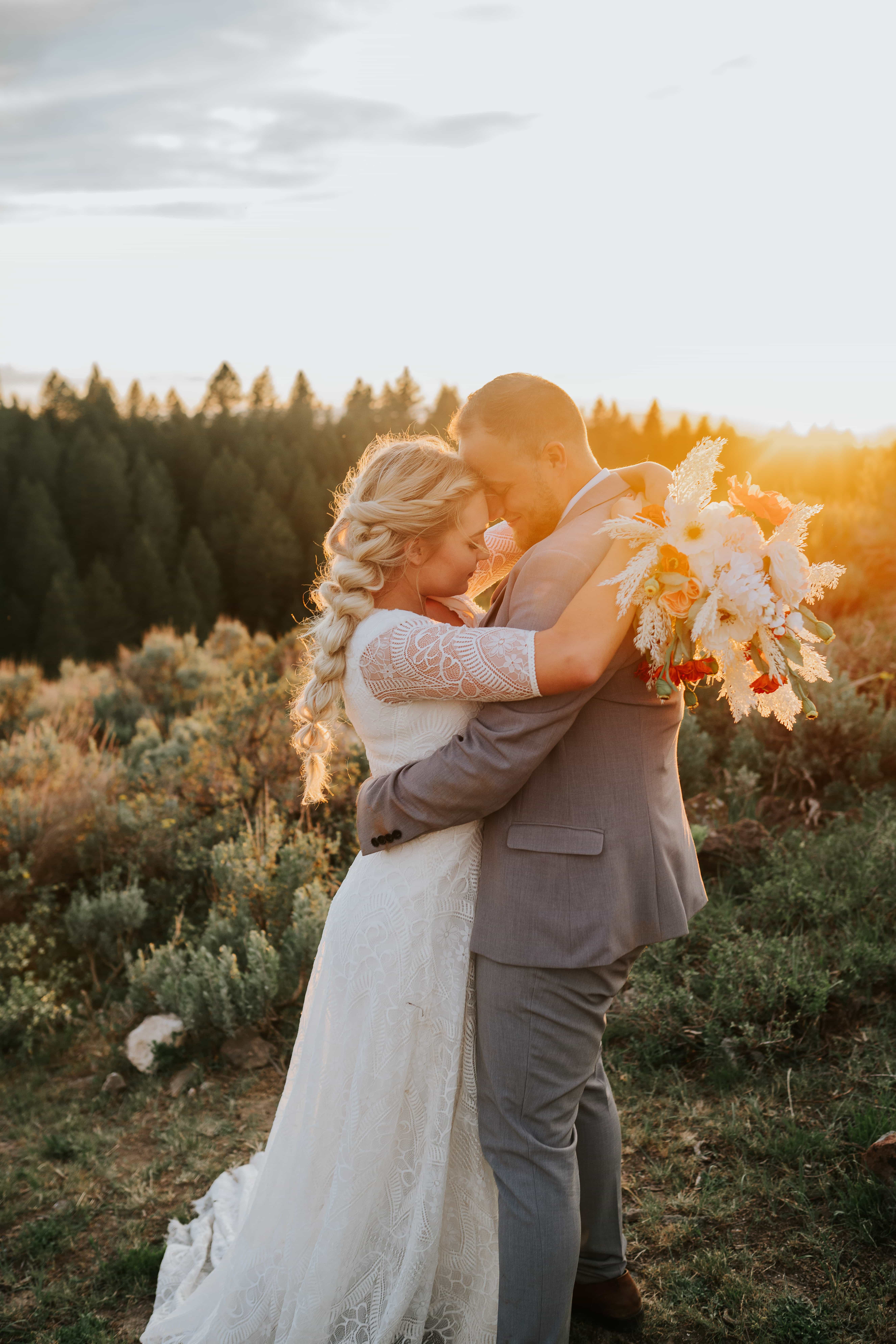 Sacramento wedding photographer captures bride and groom hugging in forest during budget friendly wedding day