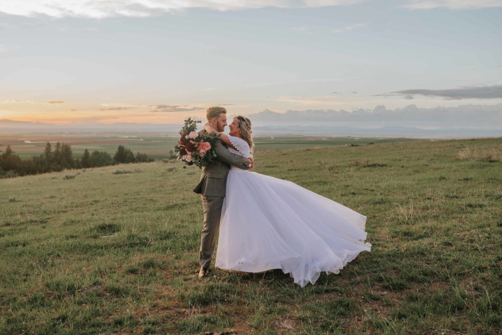 chattanooga wedding venues | bride and groom laugh and kiss as the sun sets