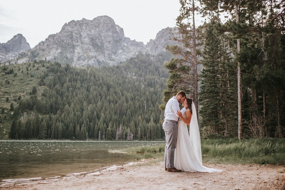 Bride and groom embracing after adventure elopement in jackson hole