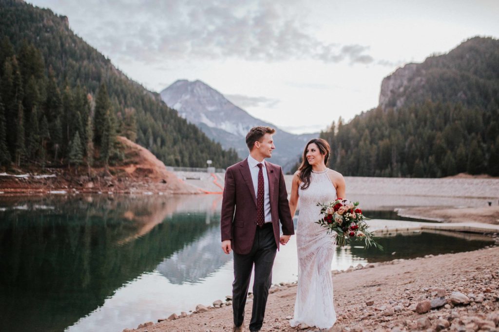 couple walking in grand teton national park after elopement