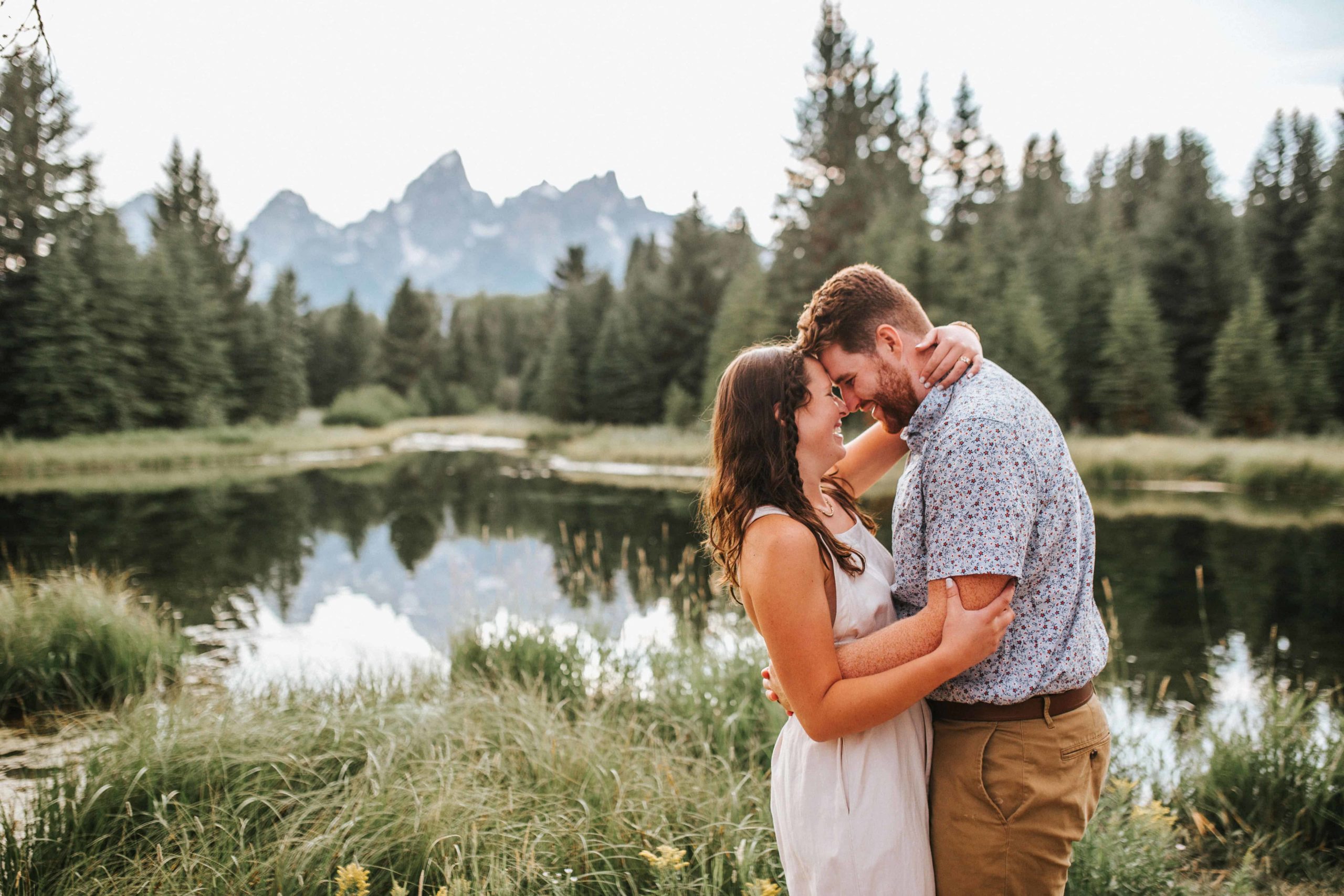 man and woman celebrating after perfect proposal in grand teton national park