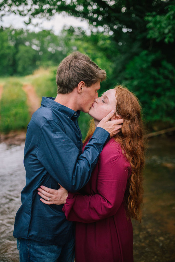 Knoxville engagement session butler's farm kissing in a beautiful TN pond
