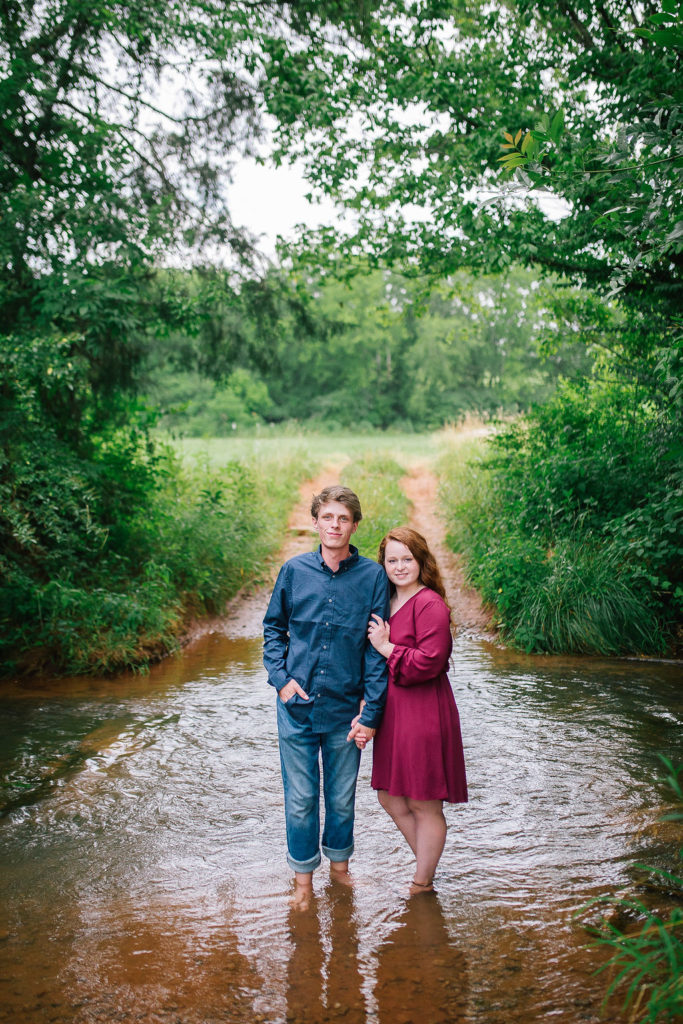 Knoxville engagement session butler's farm standing in a pond
