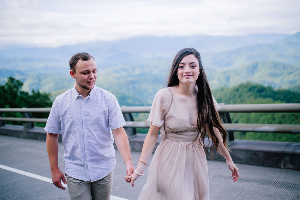 smoky mountains engagements walking on foothills parkway hand in hand