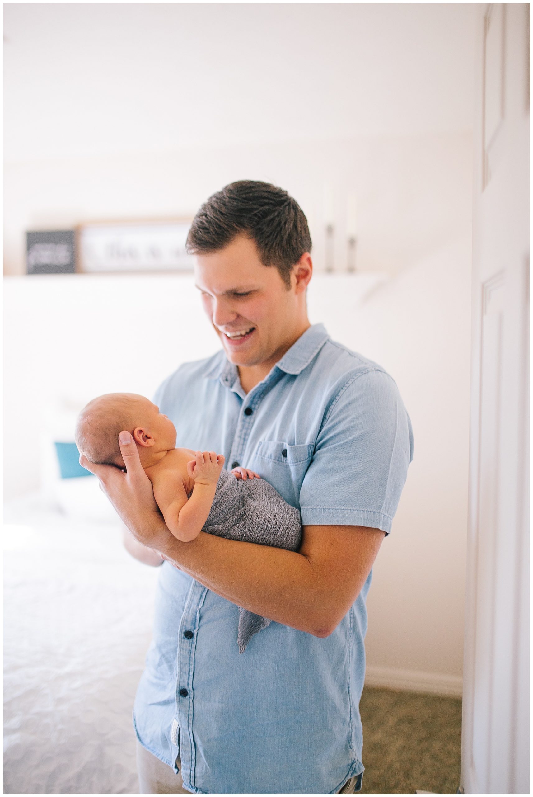 dad holding his newborn baby