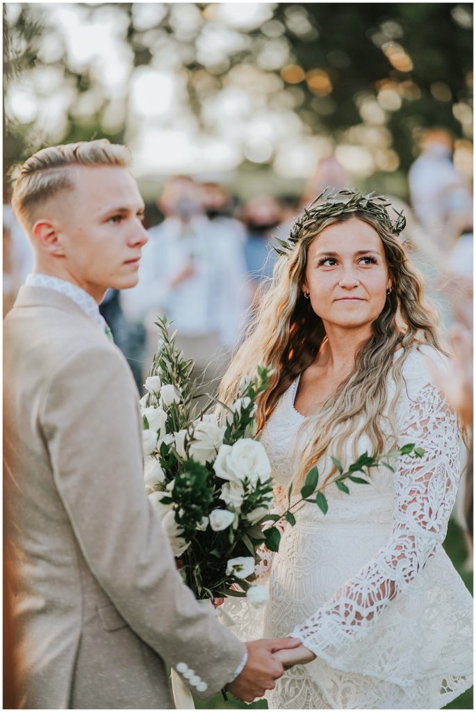 Outer Banks bohemian covid ceremony elopement look for the light photo video bride and groom during ceremony