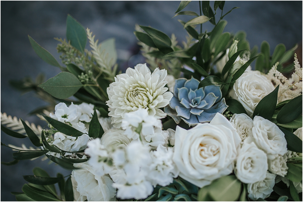 white, green, and blue wedding floral arrangement