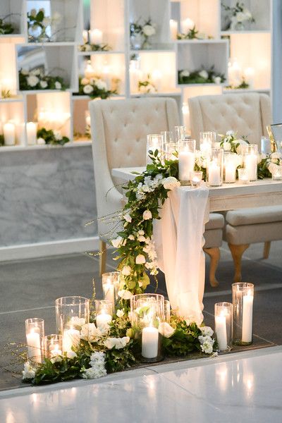 candlelit bride and groom table at wedding day reception