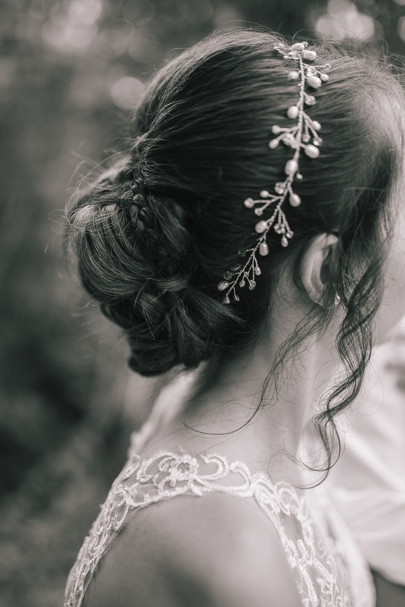 black and white photo of a brides hair and head band