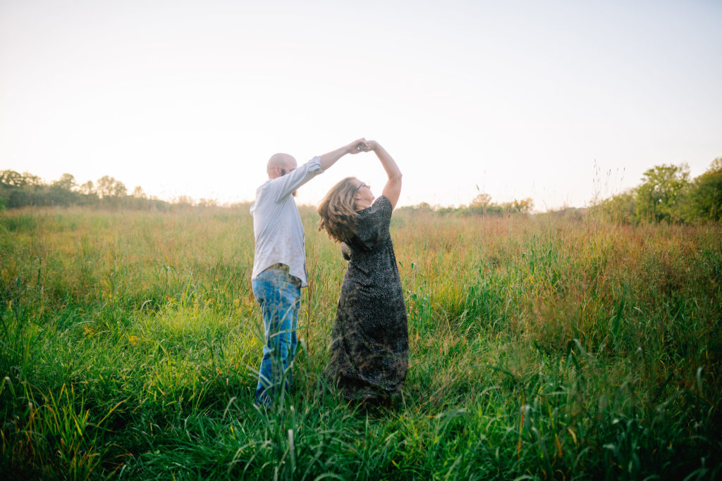 fiancés dancing in a field in Tennessee together before their wedding day