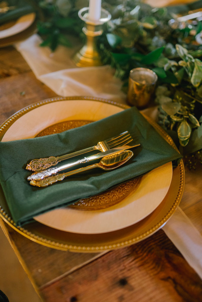 detail shot of a forest green wedding place setting
