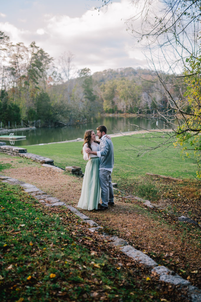 a couple in love and dancing on a dirt path in Tennessee