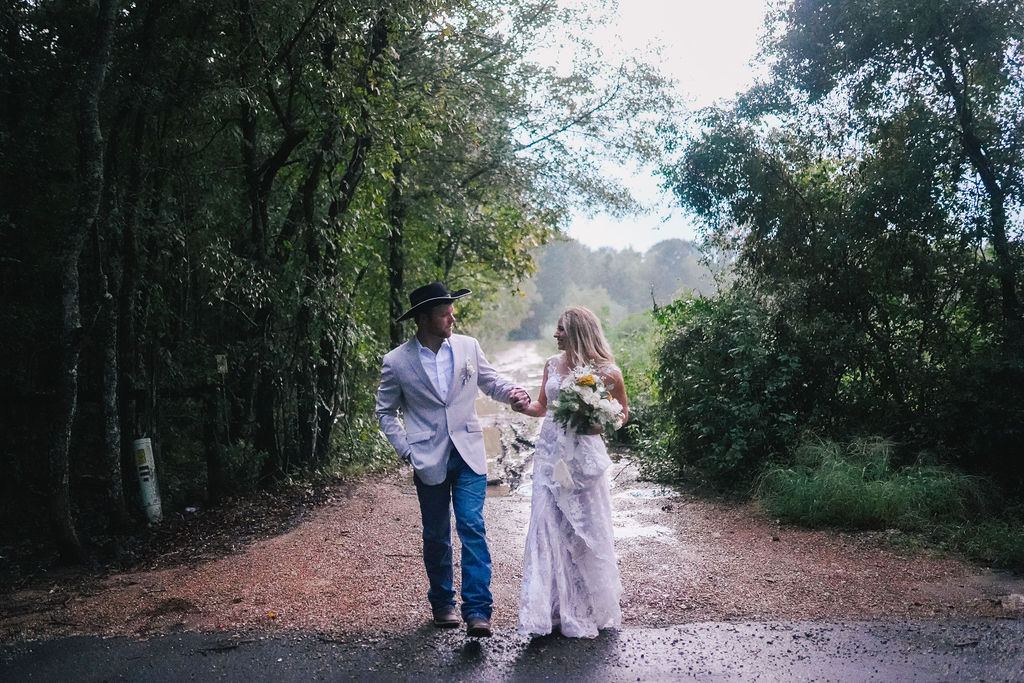 bride and groom exploring forest in louisiana after wedding ceremony
