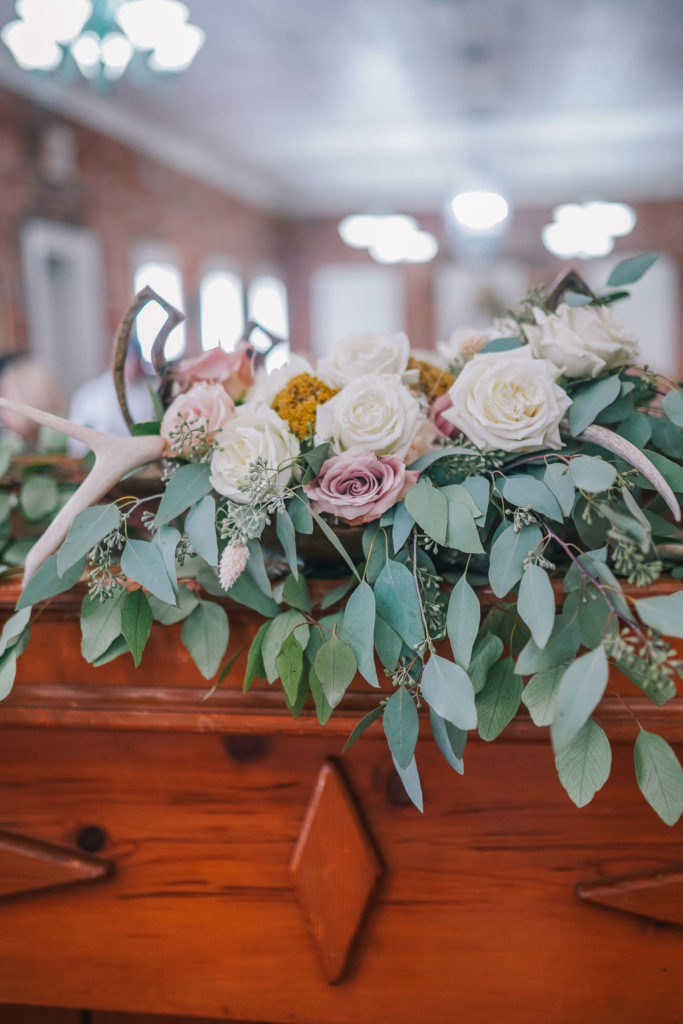 boho florals. White and dusty pink roses with eucalyptus greenery