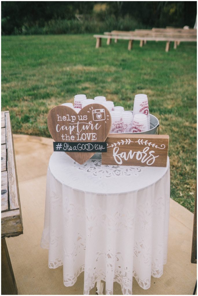cute favors table with cups and camera