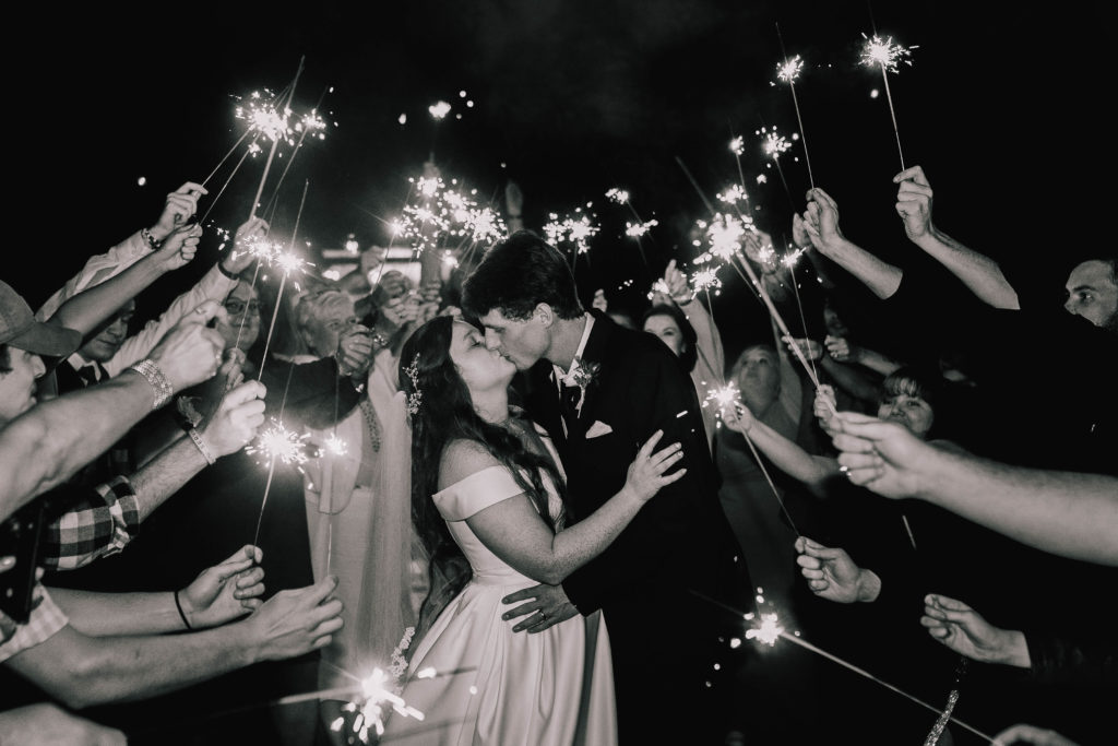 black and white photo of bride and groom during their sparkler send off the night of their wedding at Butler Farms 