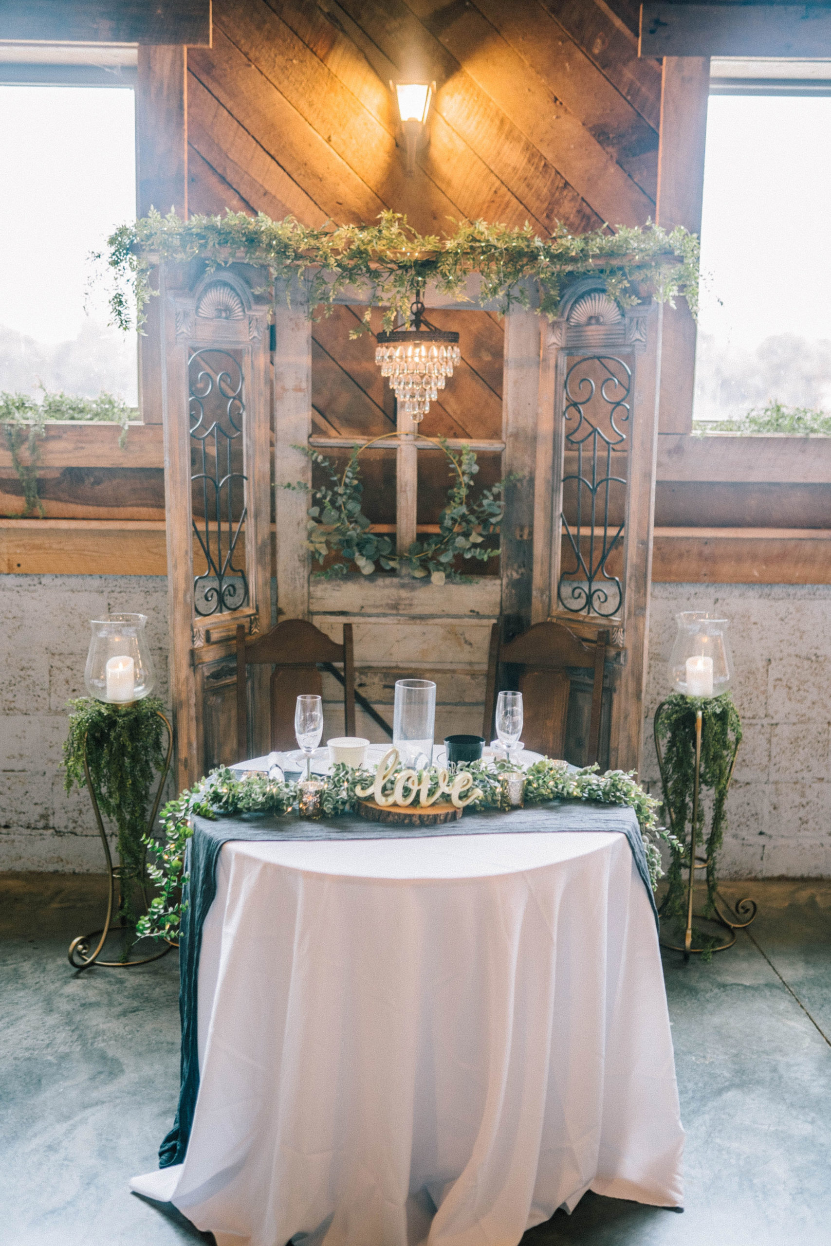 Butler Farms reception space decorated in the most elegant and rustic way for the perfect budget friendly southern wedding.
