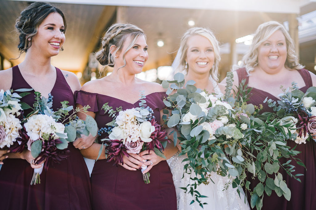 beautiful bride celebrating with bridesmaids on wedding day in knoxville wedding