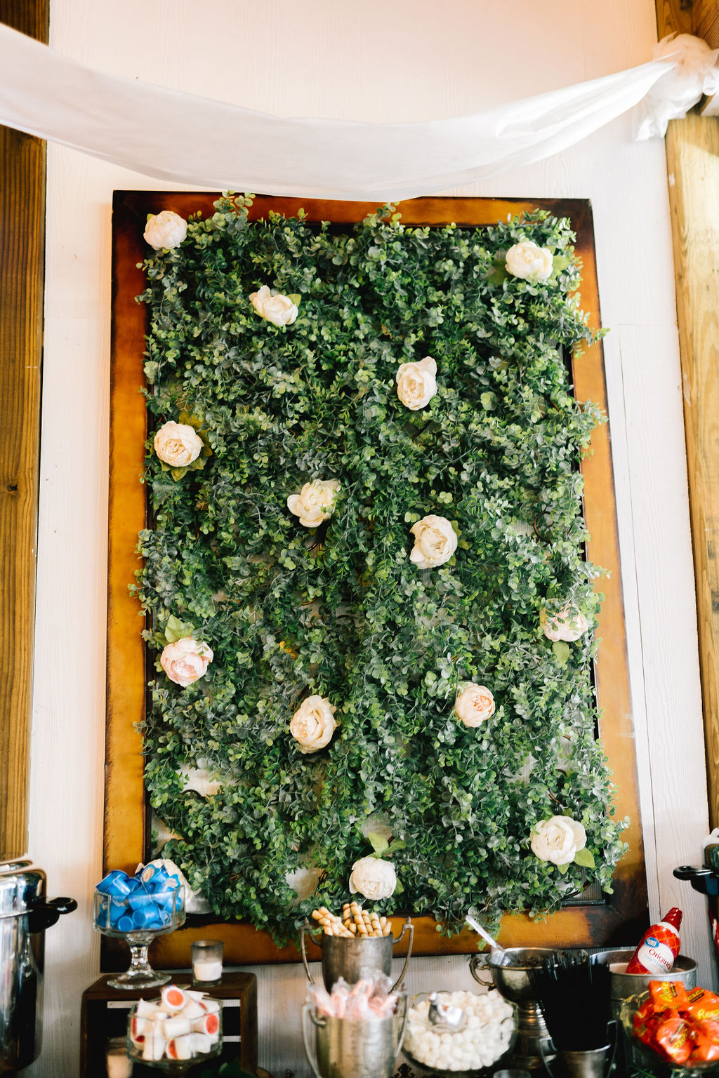 greenery wall included roses placed throughout