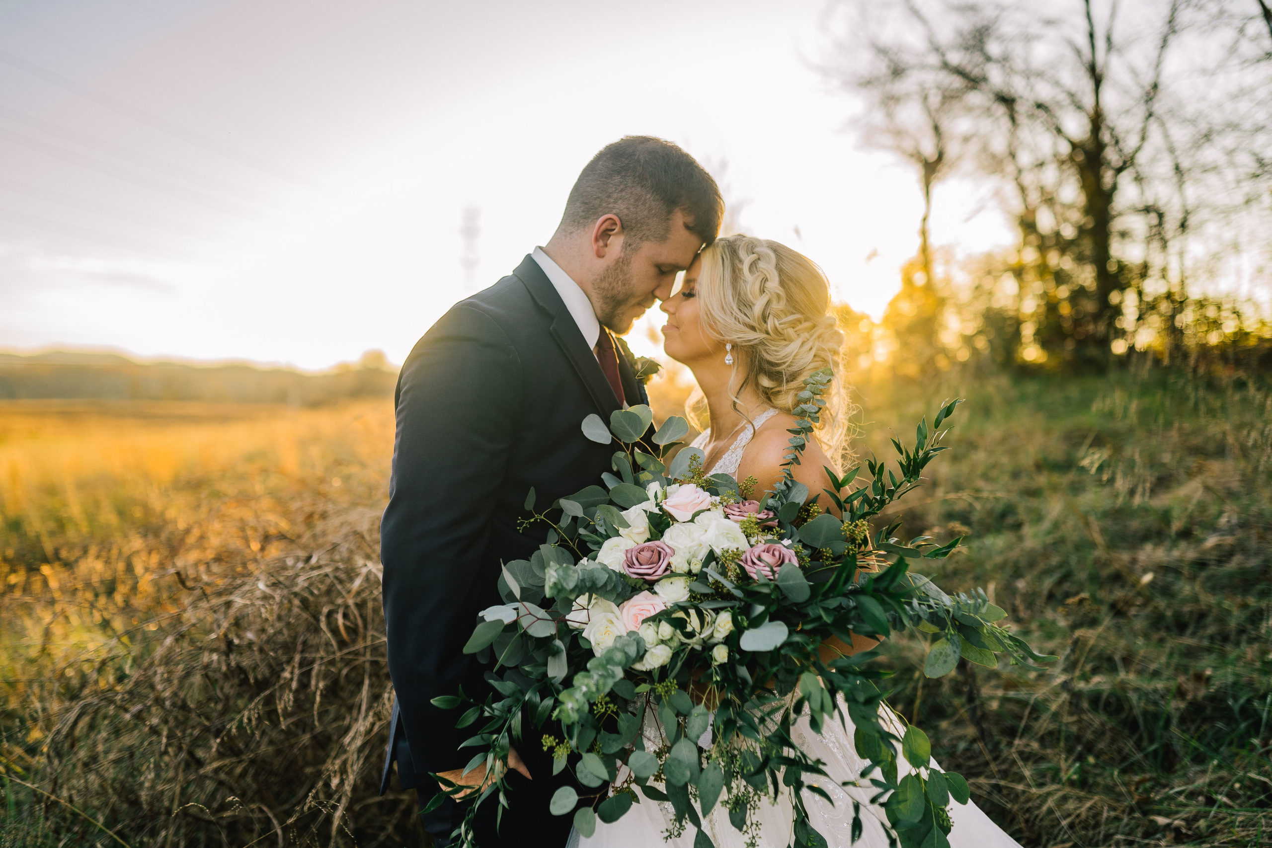Plan your Knoxville elopement with the bride and groom in the middle of a field at sunset giving all the romantic vibes