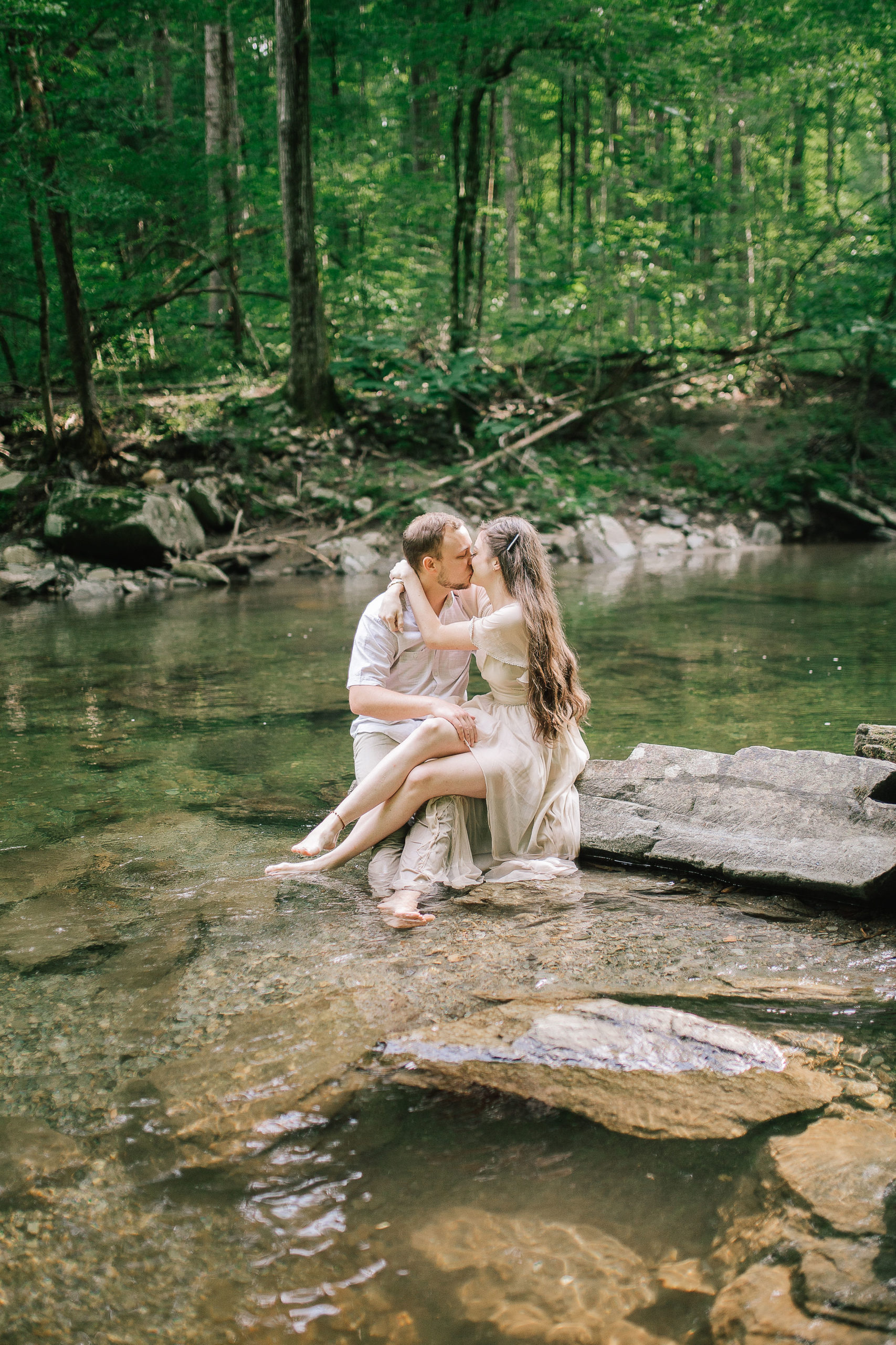 smoky mountain wedding photographer captures a couple in the stream in the foothills