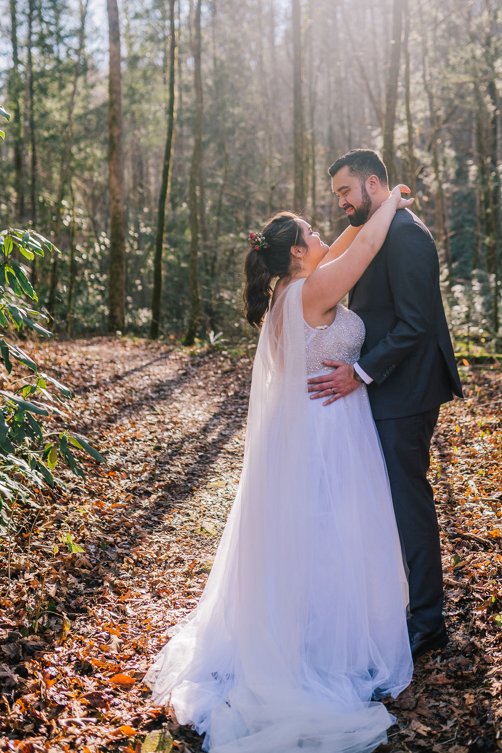 bride and groom dancing in the woods of the smoky mountains