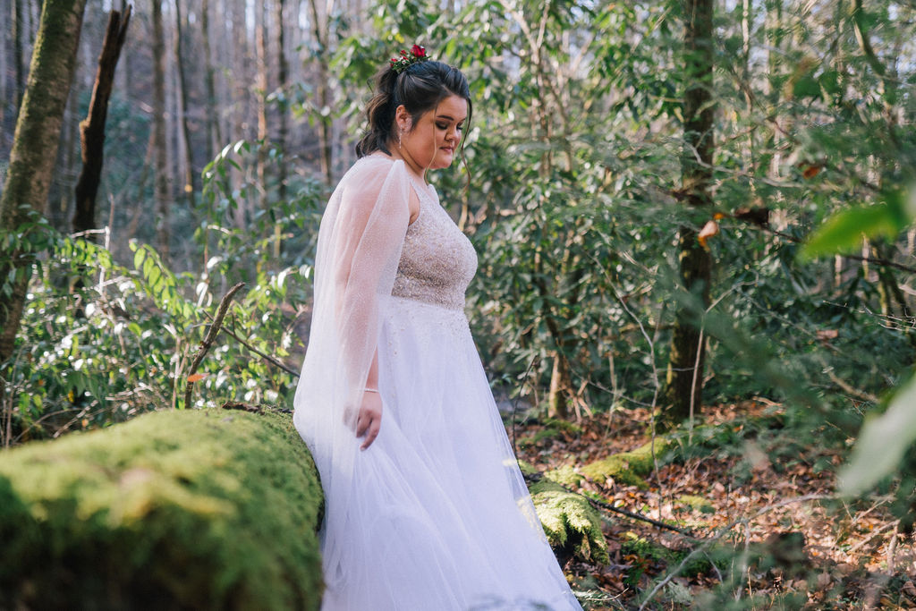 bride walking through the woods on her magical wedding day in a gorgeous sparkling gown