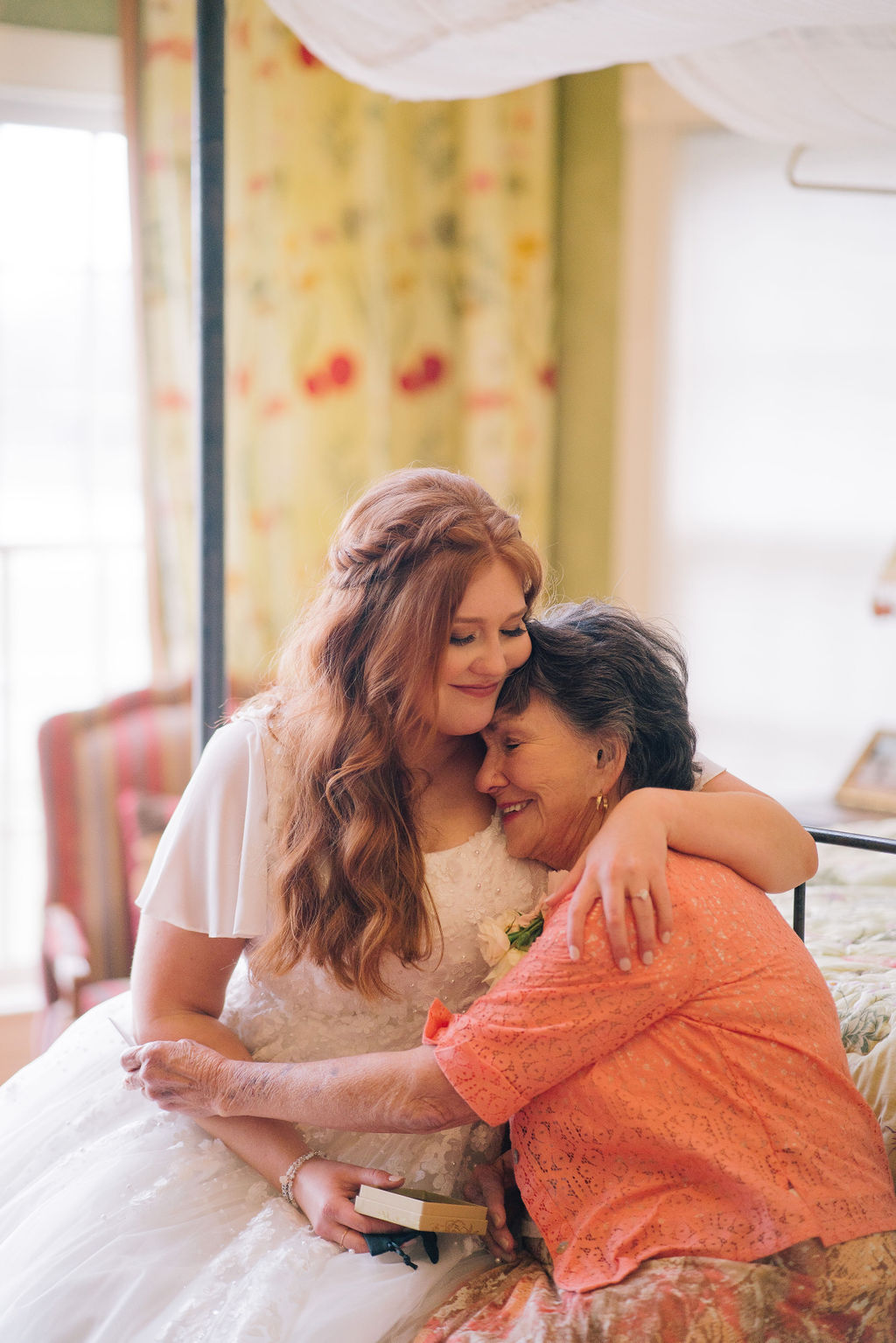 bride hugging her grandma in the brides room on her wedding day at MArblegate Farm in Tennessee