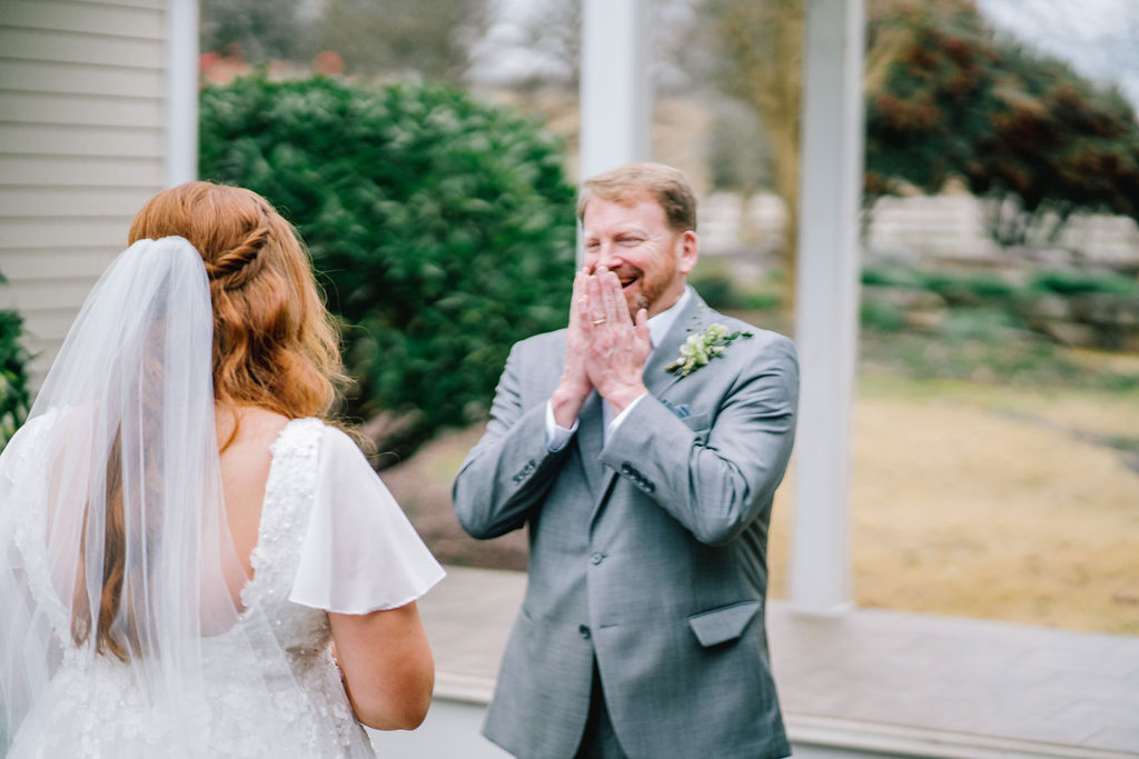 dad and bride having their first look together as the dad holding his hands to his mouth and cries at Marblegate Farms wedding venue in Tennessee