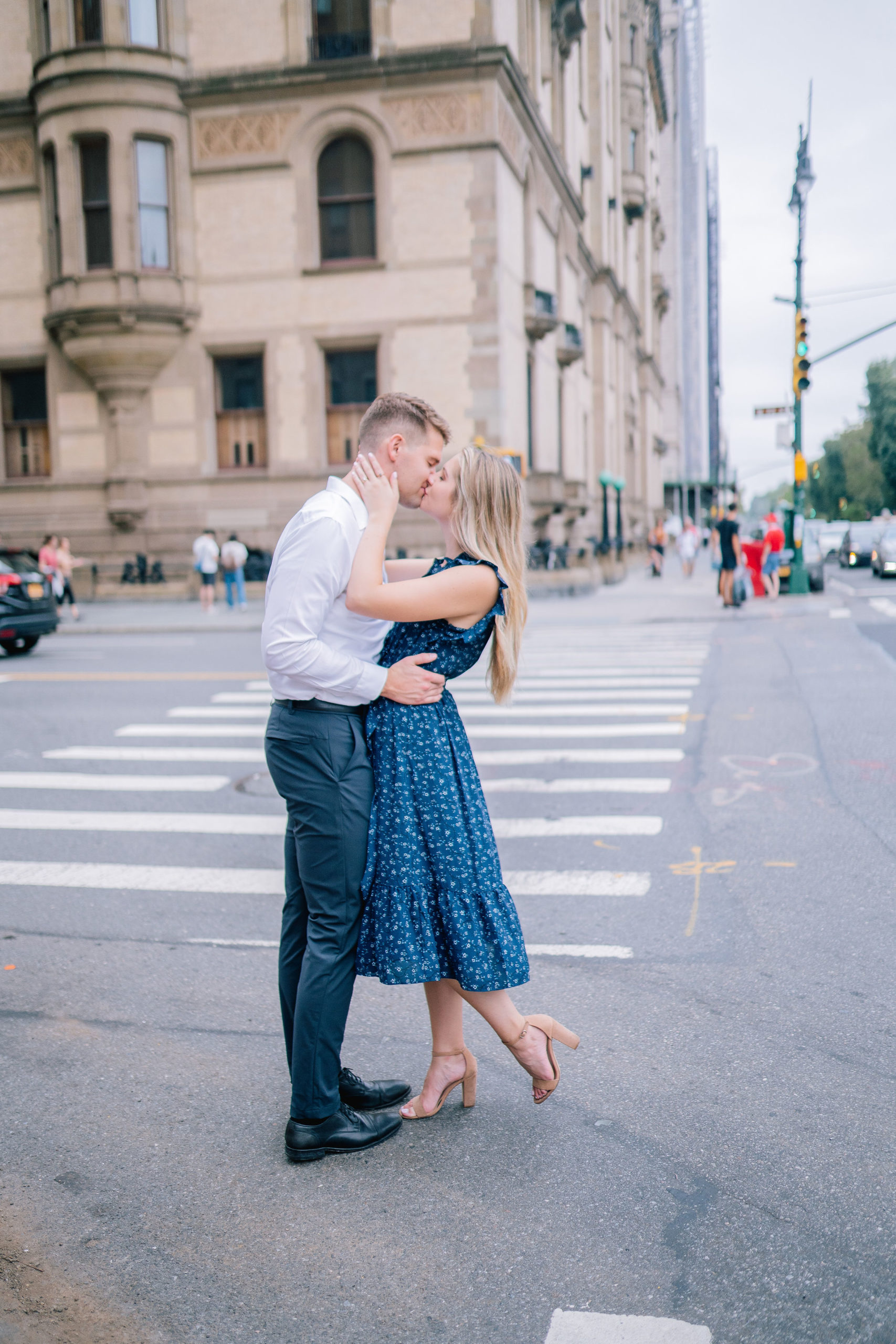 engaged couple in the streets of New York kissing during the day for their Manhattan engagement session