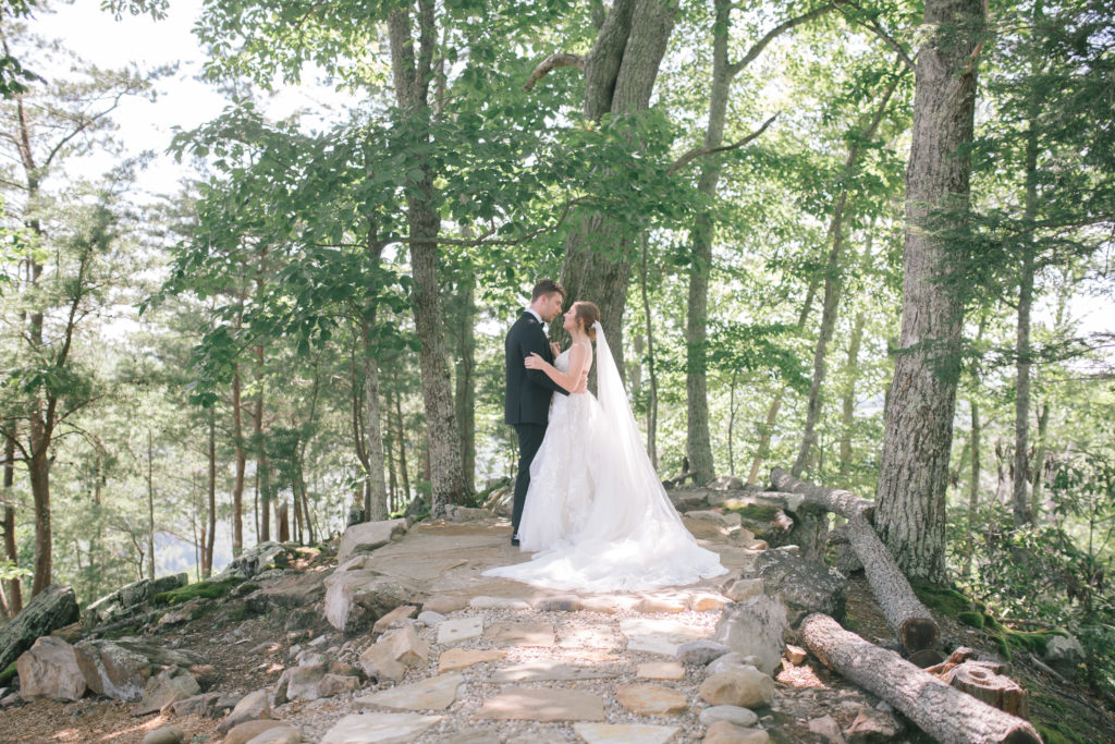 Bride and groom together in a secret garden in Pigeon Forge at The Magnolia wedding venue Pigeon Forge for their luxury bridal photoshoot