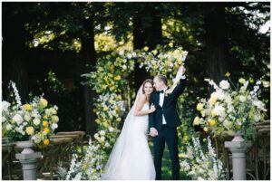 bride and groom cheer coming down the aisle at trentadue winery